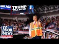 Crowd ERUPTS after Trump jokes about wearing sanitation vest