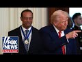 Tiger Woods joins President Trump during Black History Month event