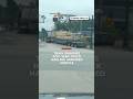 Drivers watch as a train smashes into a semi-truck hauling an armored vehicle